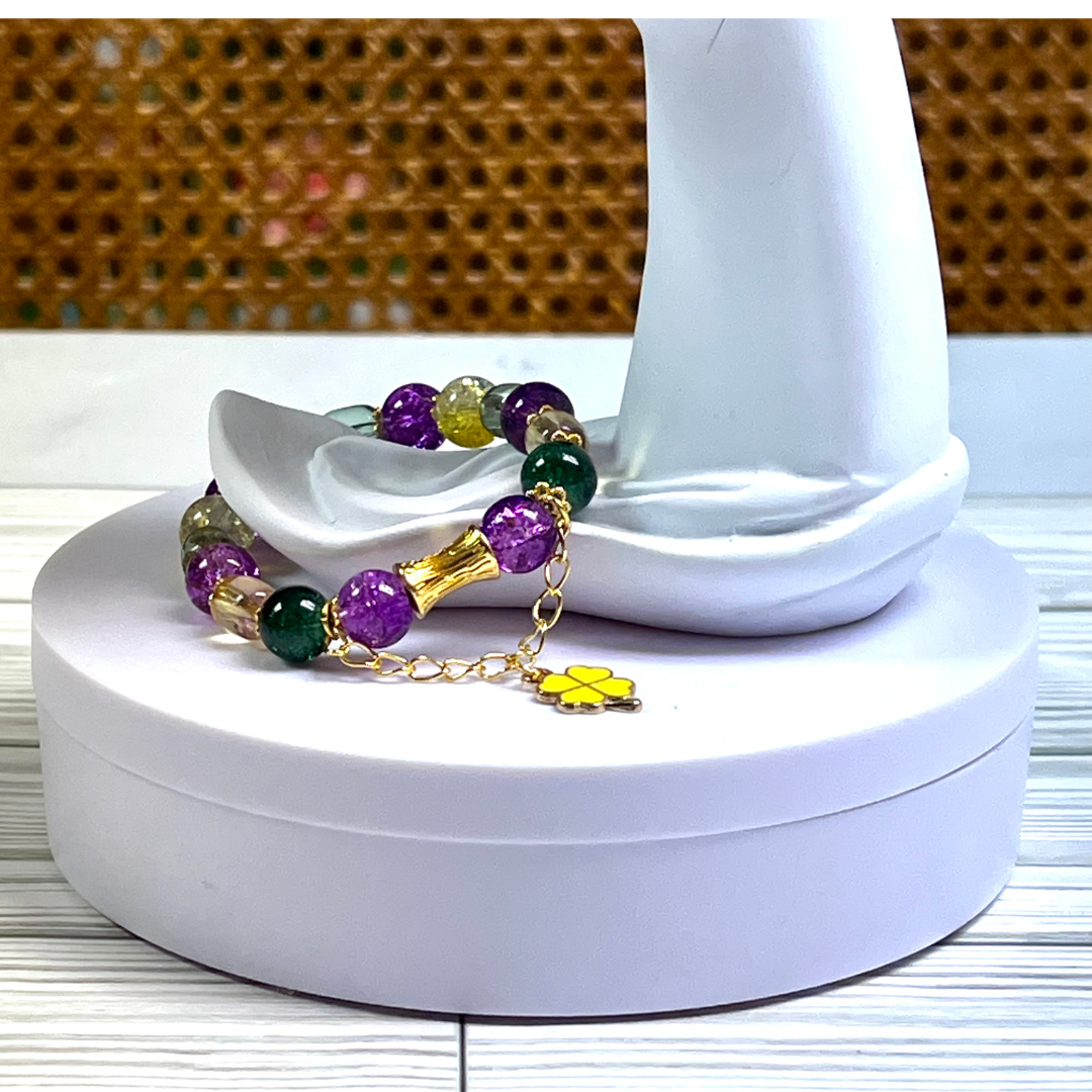 Mardi Gras Themed Glass Bead with gold spacers and charm.
